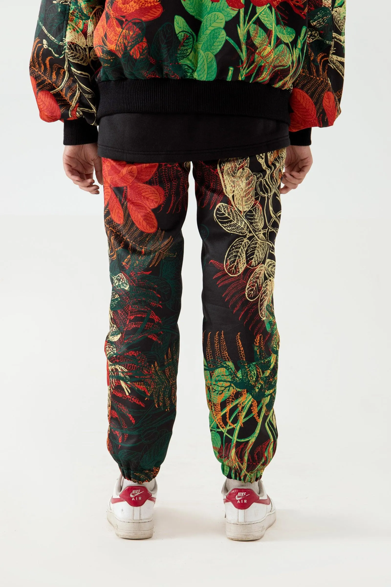 JUNGLE PRINTED SATIN SWEATPANTS